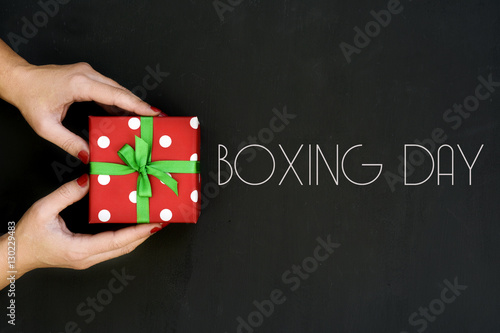 woman with a gift and text boxing day
