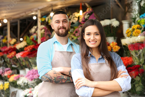 Male and female florists in flower shop