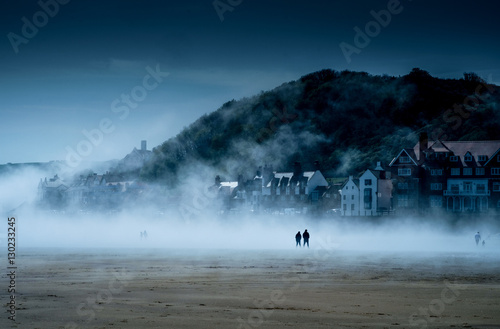 figures in a beach mist
