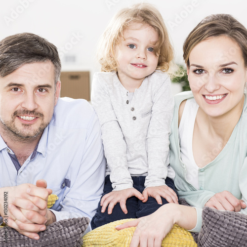 Smiling young couple and small boy