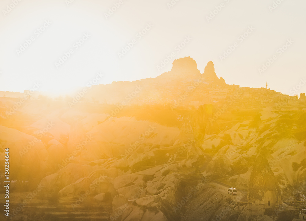 Naklejka premium Colorful sunset over rocks of Goreme and Uchisar castle in Cappadocia region, Central Turkey