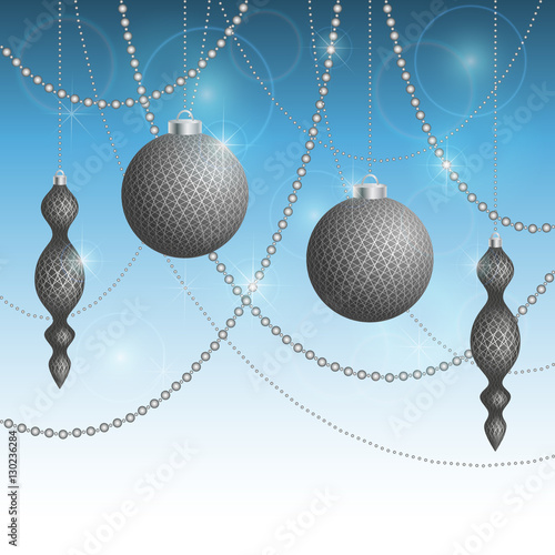 Silver Christmas tree decorations on a blue background