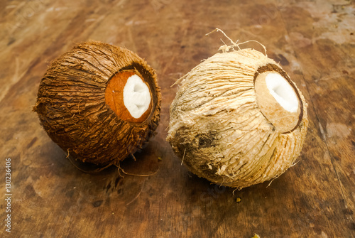 Two coconuts on table