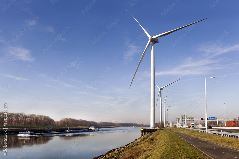 Wind turbines near canal Hartel in Rotterdam Wind turbines near canal Hartel in Rotterdam