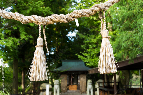 Shinto symbol rope from rice straw in temple © leungchopan