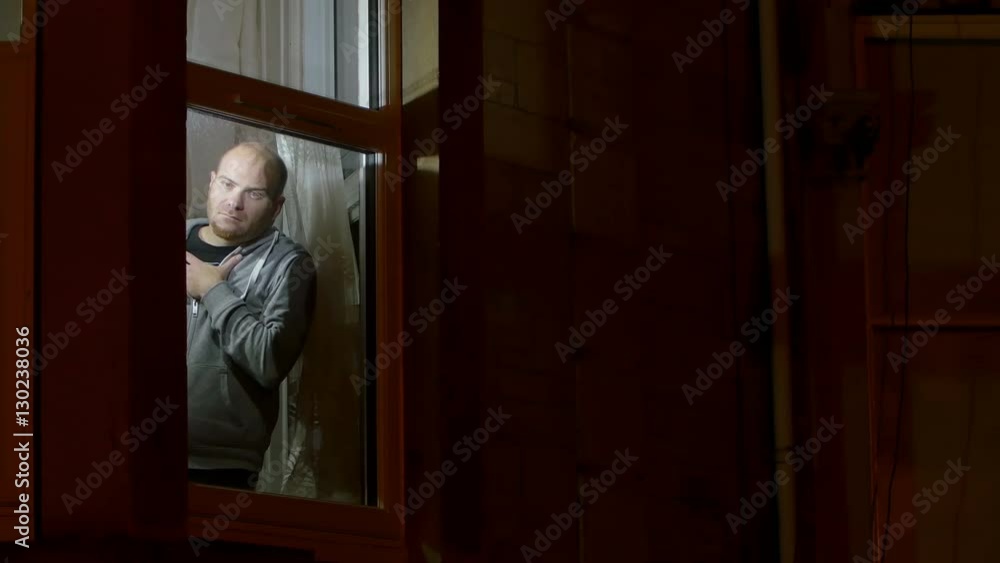 man suffering of insomnia looks concerned in the night, room lighted man suffering of insomnia looks concerned in the night, room lighted