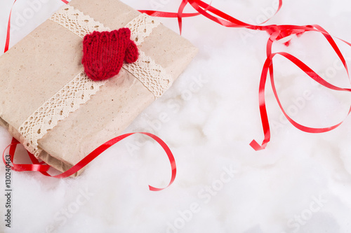 Christmas boxes with gifts tied with ribbon and pine cones on white background