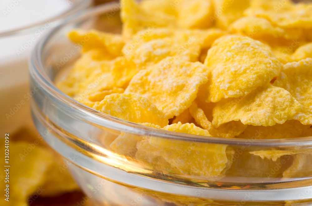 Defocused and blurred image of a glass cup with cornflakes Defocused and blurred image of a glass cup with cornflakes