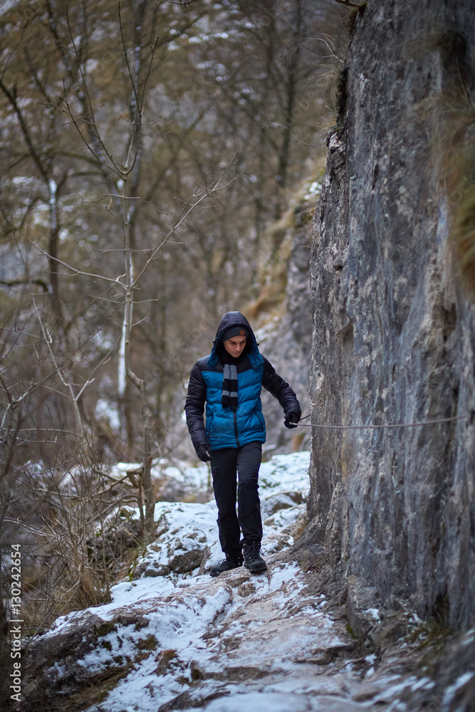 Teenage boy hiking in winter