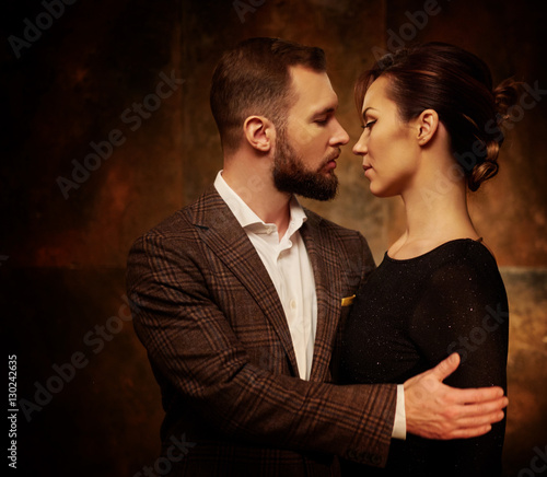 Portrait of well-dressed couple in expression of feelings