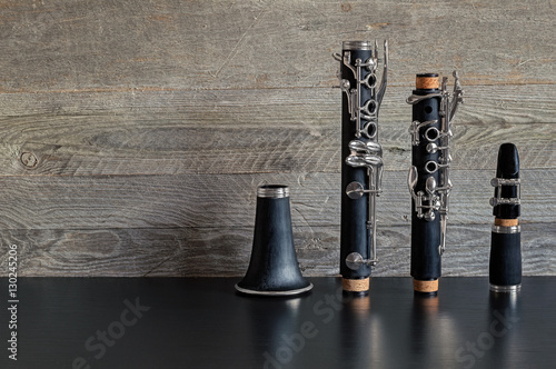 Fotomurale Dismantled Clarinet on a Black Table