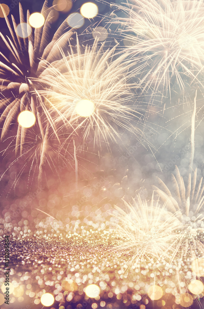 Fototapeta premium Vintage gold and green Fireworks and bokeh in New Year eve and copy space. Abstract background holiday.