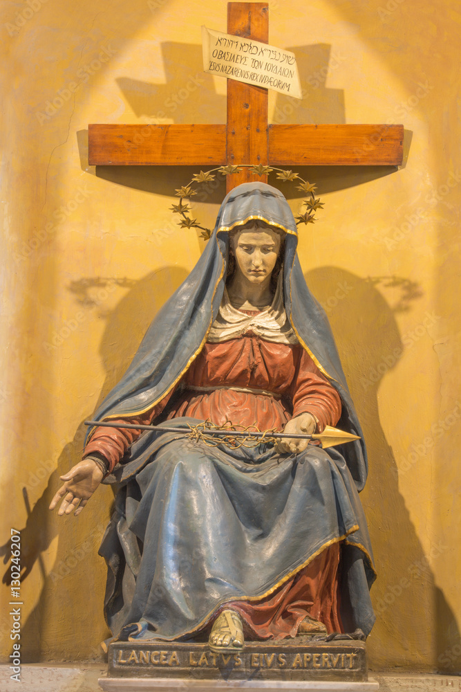 ROME, ITALY - MARCH 12, 2016: The carved statue of Lady of Sorrow with the lance in church Chiesa di Nostra Signora del Sacro Cuore by unknown artist.