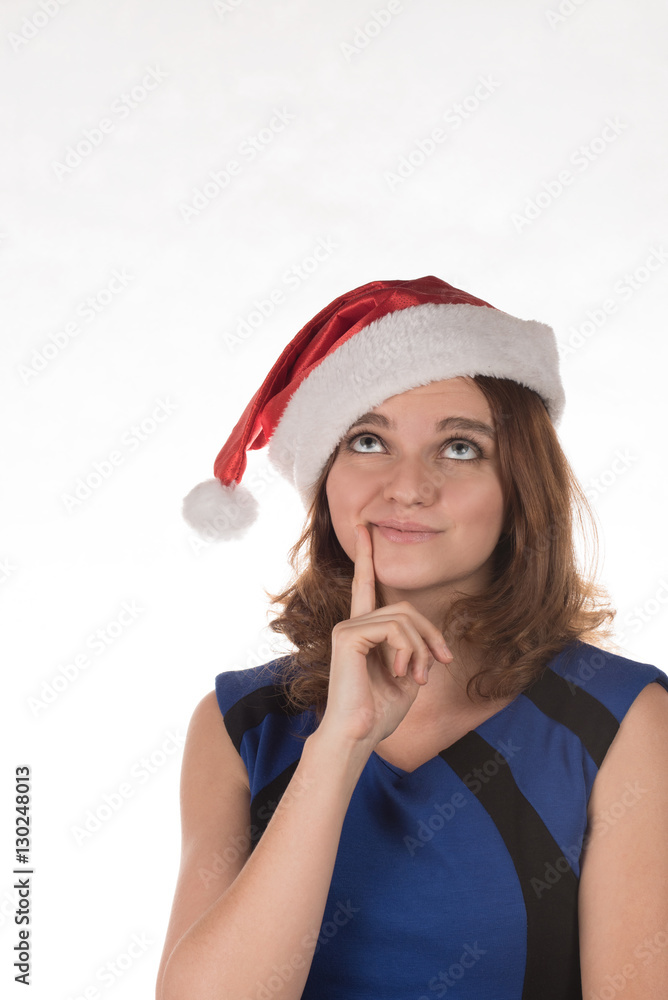 Girl in a red Christmas hat with different funny emotion on his Girl in a red Christmas hat with different funny emotion on his