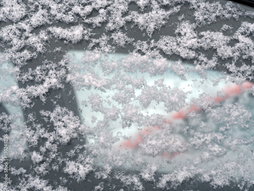 Frozen side window of car closeup, snow on car glass © ANGHI