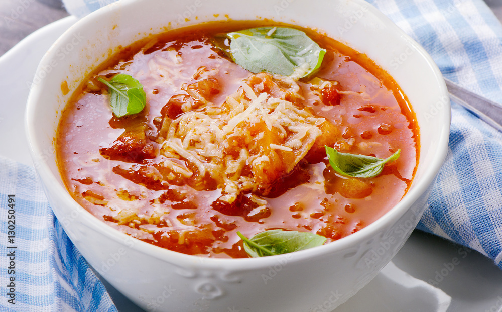 Homemade tomato soup sprinkled with cheese Homemade tomato soup sprinkled with cheese