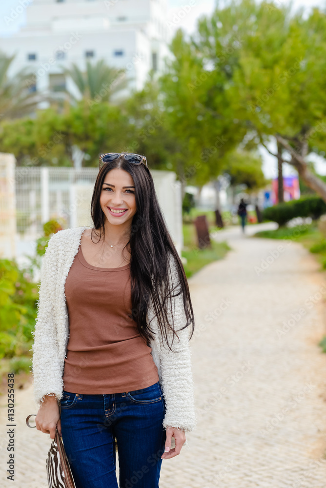 Portrait of beautiful smiling active woman walking background outdoors Portrait of beautiful smiling active woman walking background outdoors