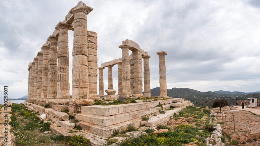 Tourists visit the Temple of Poseidon