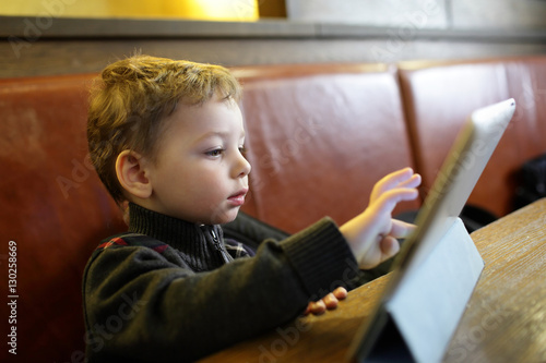 Kid playing on a Tablet PC
