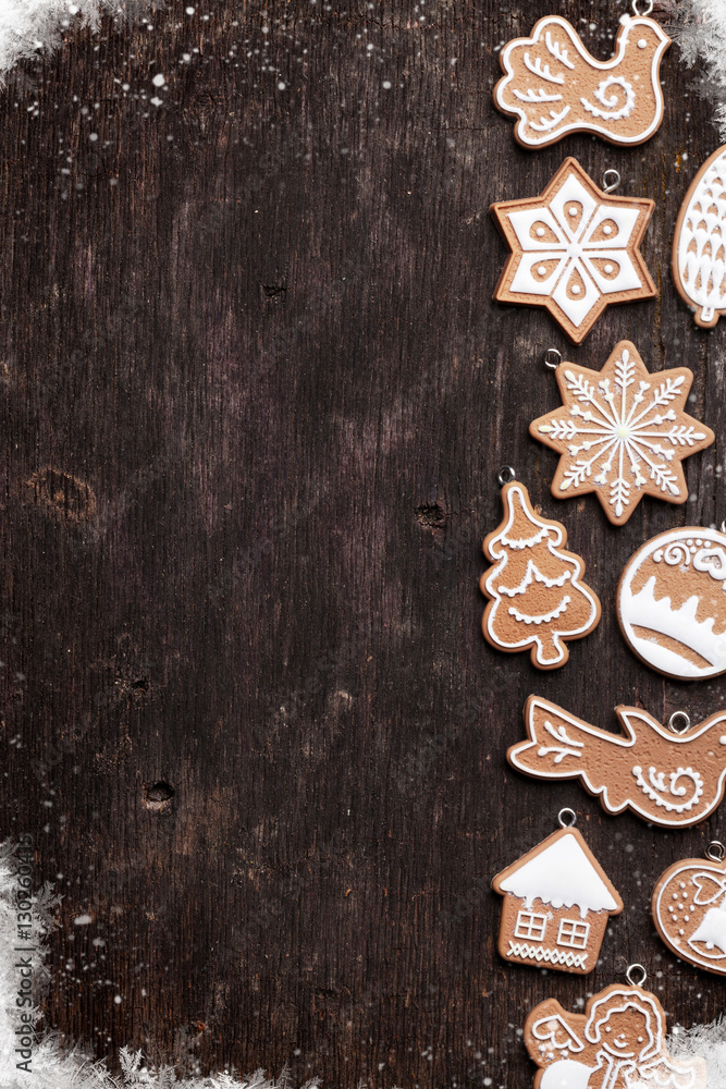 Christmas wooden background with gingerbread cookies Christmas wooden background with gingerbread cookies