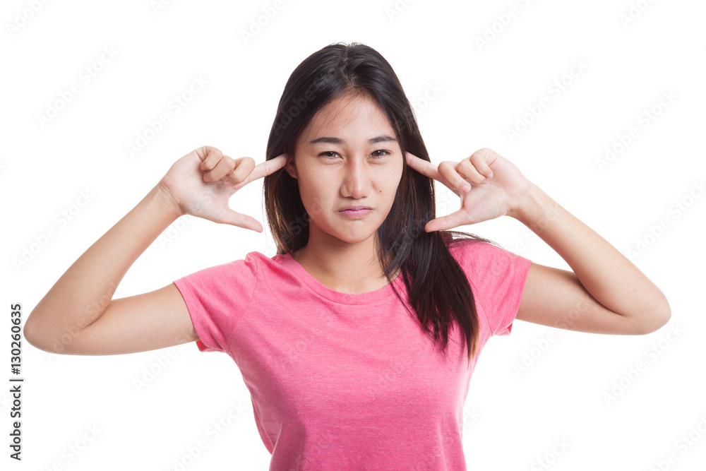 Young Asian woman block both ears with fingers.. Young Asian woman block both ears with fingers..