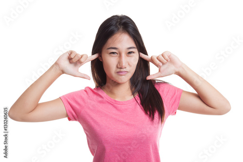 Young Asian woman block both ears with fingers.. © halfbottle