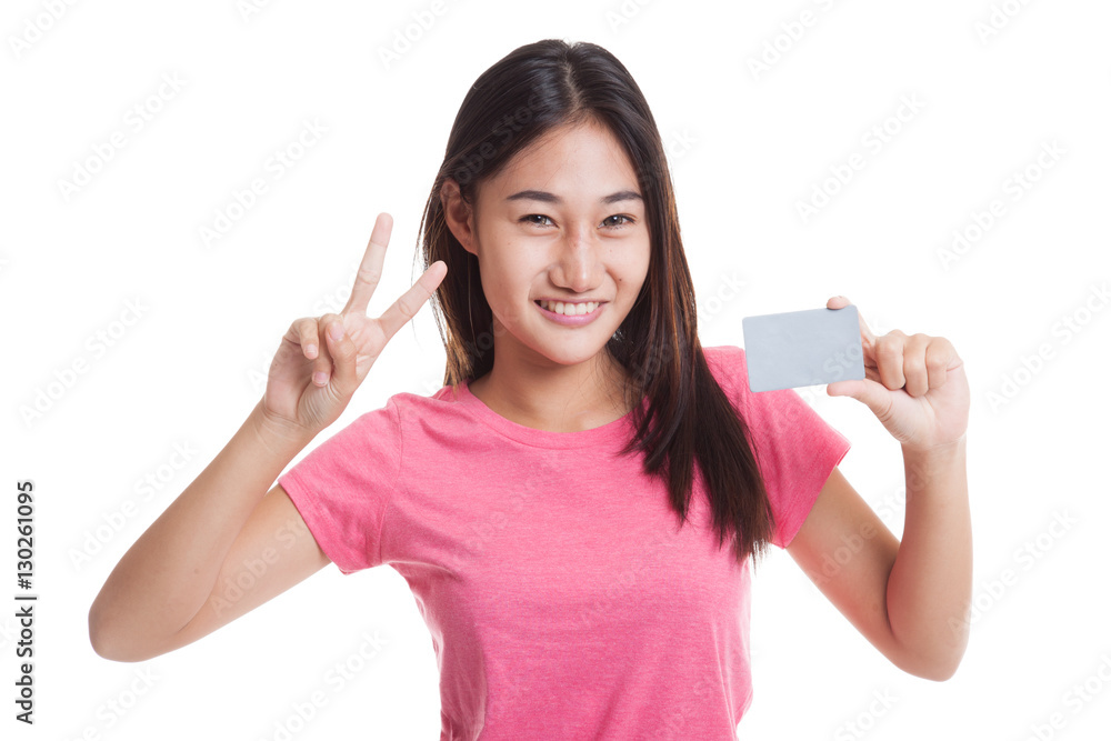 Young Asian woman show Victory with a blank card.. Young Asian woman show Victory with a blank card..