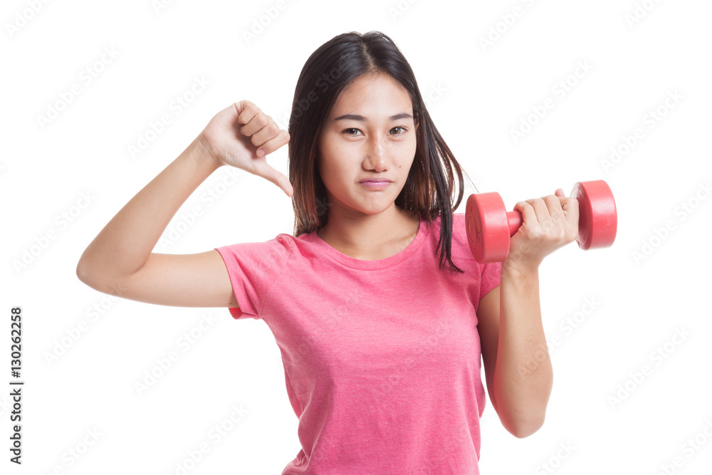 Unhappy Asian woman thumbs down with dumbbells. Unhappy Asian woman thumbs down with dumbbells.