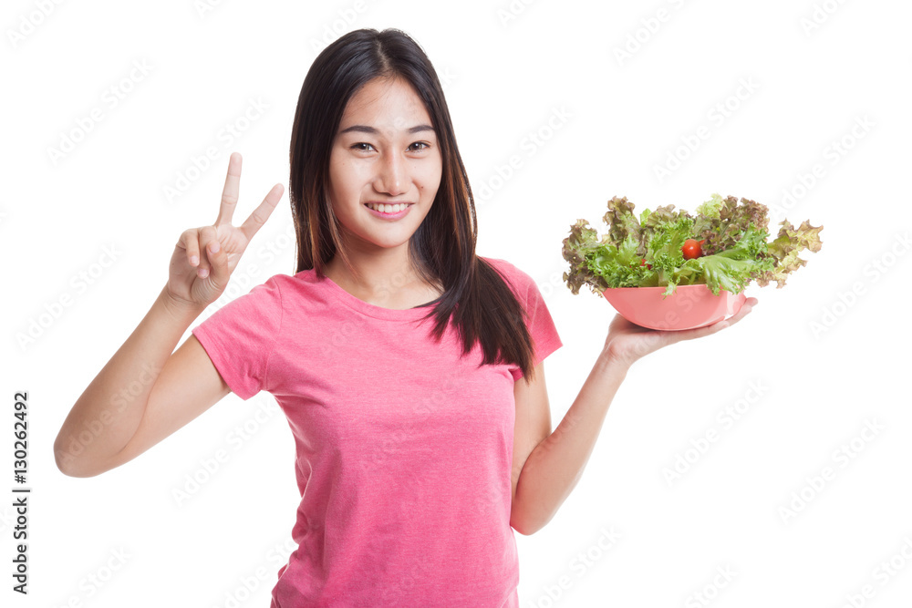 Healthy Asian woman show victory sign with salad. Healthy Asian woman show victory sign with salad.