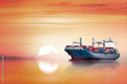 International Container Cargo ship in the ocean as sunset sky  Freight Transportation  Shipping