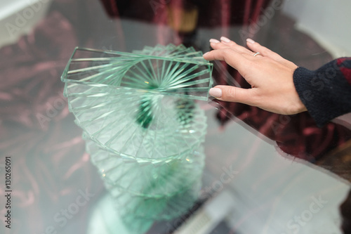 unusua transparent glass table with hand photo