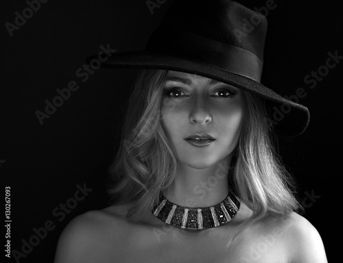 Glamour sexy makeup woman posing in fashion hat and gold necklac photo