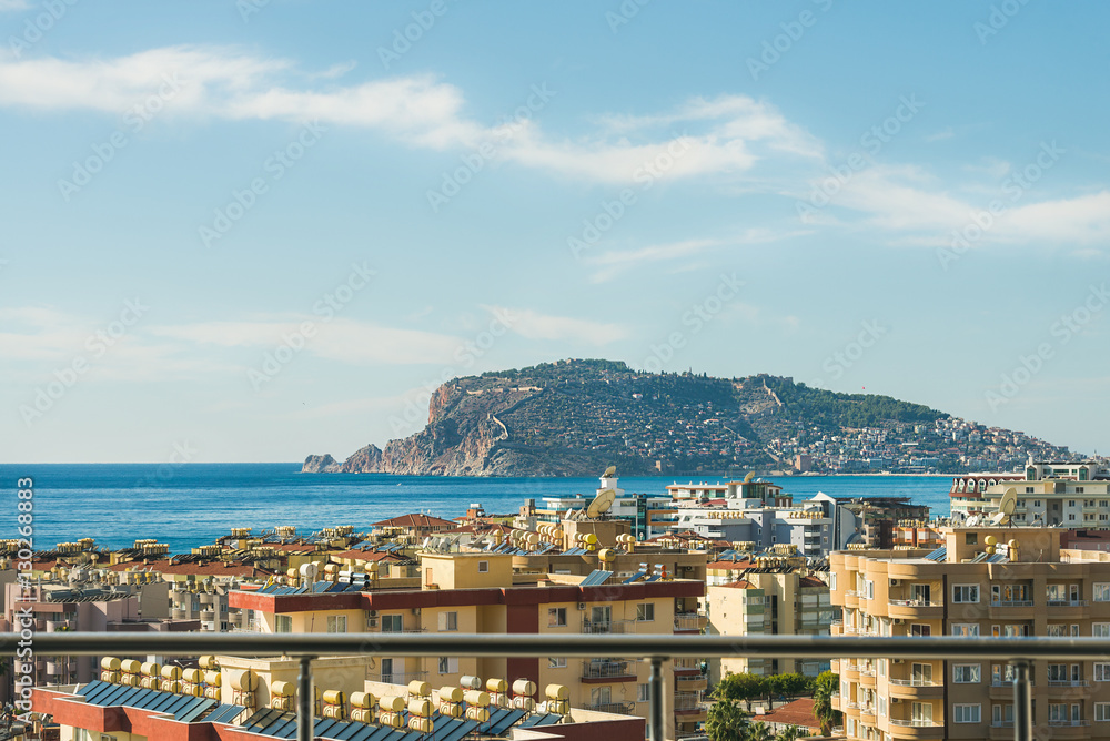 View over the castle hill of Alanya, Turkey, and Mediterranean sea from private balcony in Tosmur district. Concept of living at the sea coast