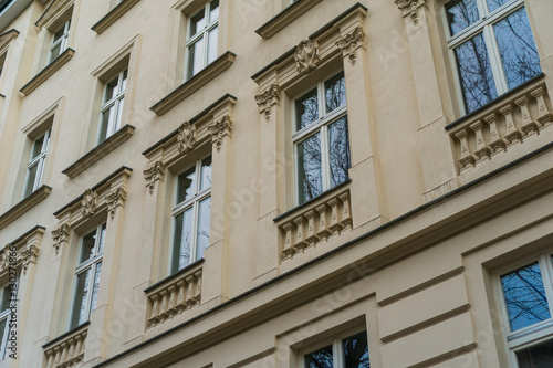 detailed view of orange facade with beautiful windows