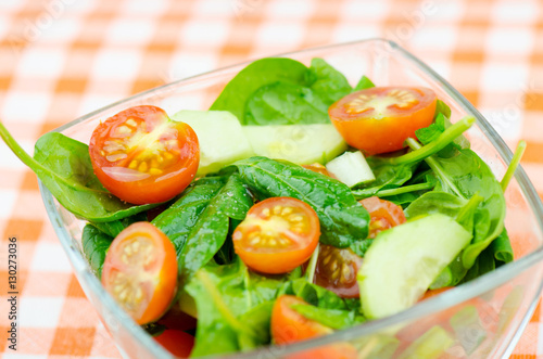Fresh Green Salad With Spinach, Cherry Tomatoes, Cucumber, Green Onion And See Salt Close Up