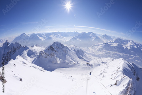 View from summit of Valluga in St. Anton am Arlberg in winter snow, Austrian Alps, Austria photo