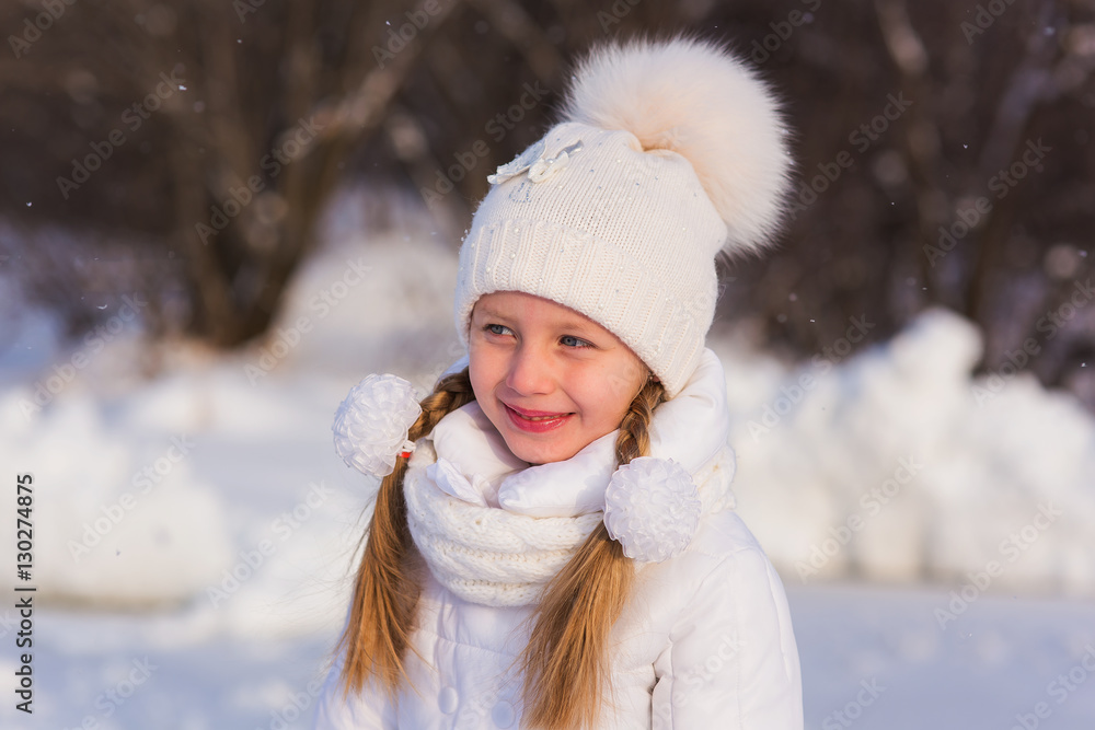 Portrait cute girl with two braids in winter snowy day Portrait cute girl with two braids in winter snowy day