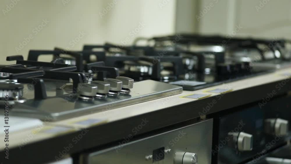 rows of gas stoves selling in home appliance store rows of gas stoves selling in home appliance store
