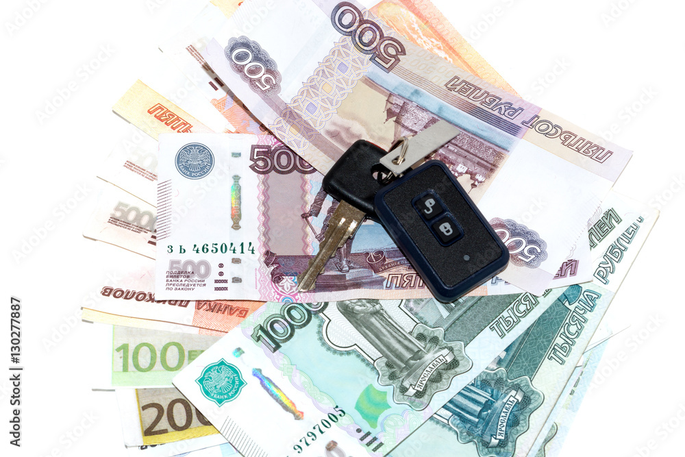 Car keys and money isolated on white background