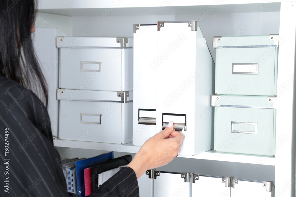 File folders, standing on shelves in the background File folders, standing on shelves in the background