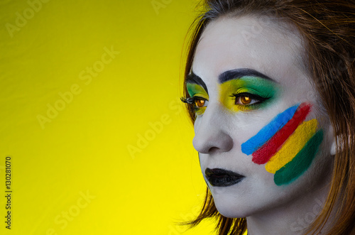 Fototapeta Naklejka Na Ścianę i Meble -  Sensual girl with colorful bodyart and face art       