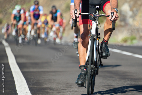 Fototapeta Naklejka Na Ścianę i Meble -  Cycling competition,cyclist athletes riding a race at high speed
