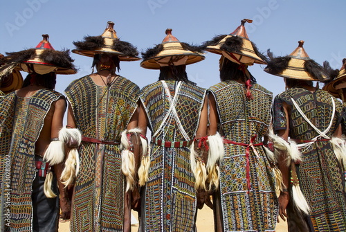 Back view of a group of Wodaabe (Bororo) men at the annual Gerewol male beauty contest, the general reunion of West Africa for the Wodaabe Peul (Bororo Peul) people, Niger, West Africa photo