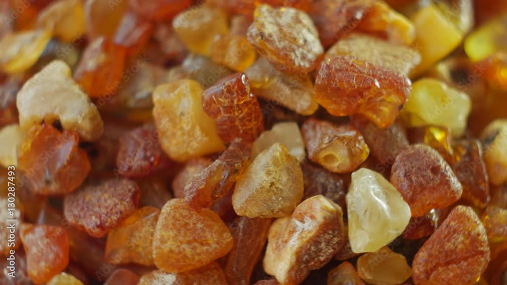Amber stone macro rotate. Baltic gold. Small pieces Amber stone macro rotate. Baltic gold. Small pieces