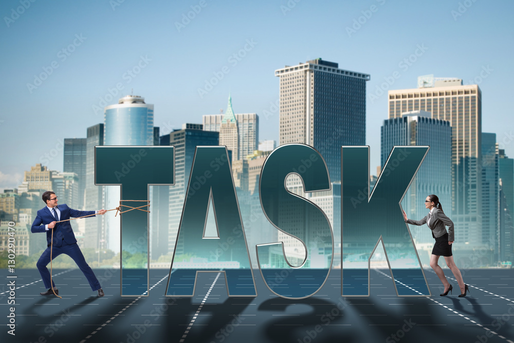 Obraz premium Businesswoman and businessman in task concept