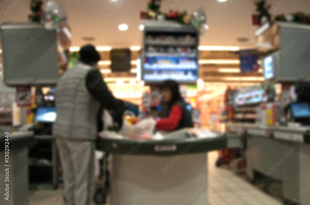 Blurred supermarket interior with cash register
