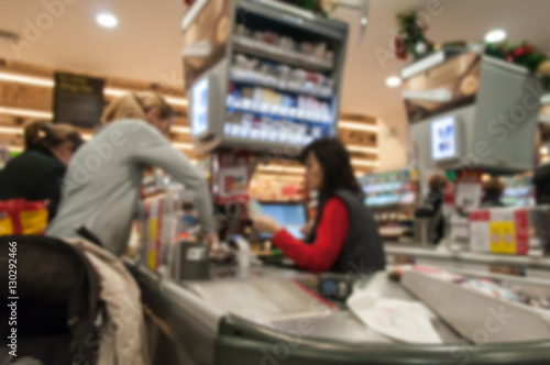 Blurred supermarket interior with cash register