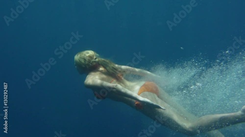 Slow Motion Of Woman Swimming Underwater