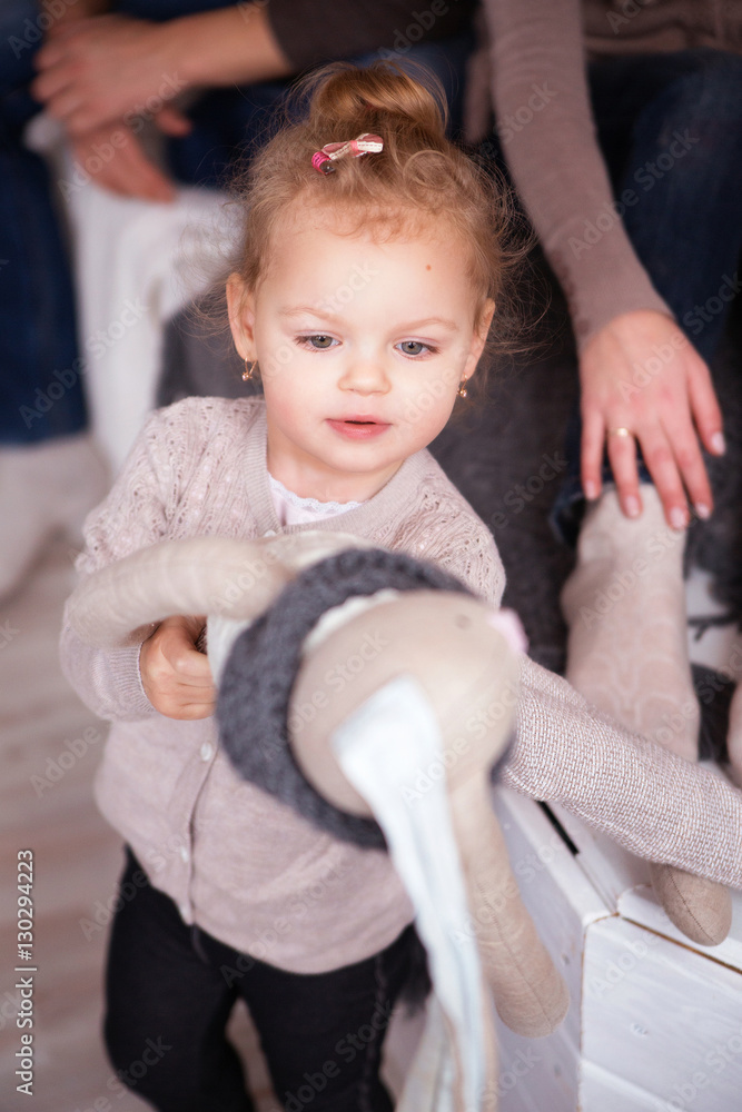 Little pretty girl look at her toy rabbit Little pretty girl look at her toy rabbit