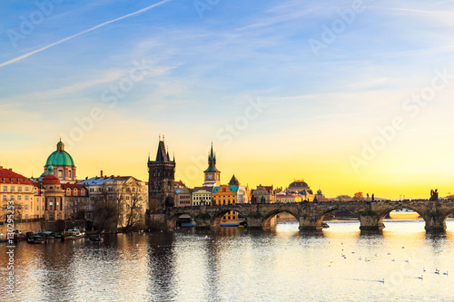 Old Town pier architecture and Charles Bridge over Vltava river in Prague